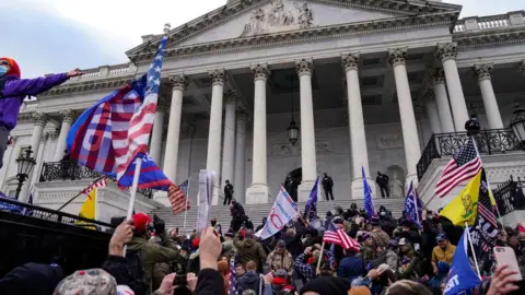 Getty Images Crowds gather outside the U.S. Capitol for the "Stop the Steal" rally on 6 January, 2021