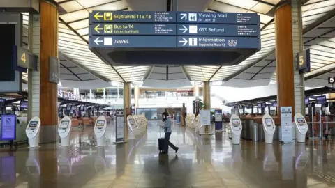 Getty Images Singapore's Changi Airport has warned of a "daunting period" ahead.