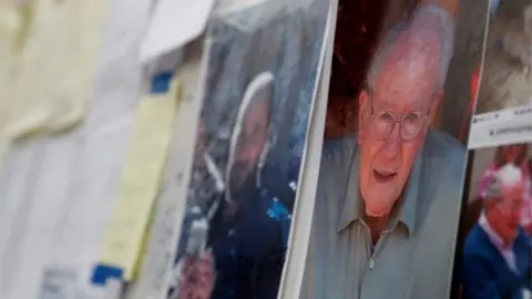 Reuters Missing photographs posted at evacuation centre in Chico