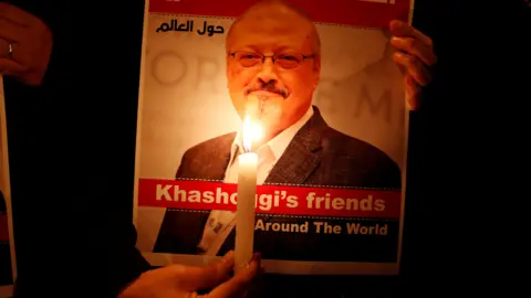Osman Orsal A demonstrator holds a poster with a picture of Saudi journalist Jamal Khashoggi outside the Saudi Arabia consulate in Istanbul, Turkey, in October 2018