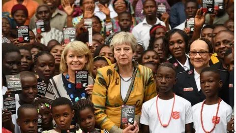 PA Theresa May and Foreign Office minister Harriet Baldwin meet Salvation Army workers in Lagos
