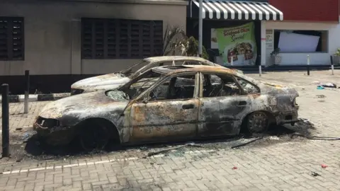 Getty Images Destroyed property in Lekki suburb in Nigeria