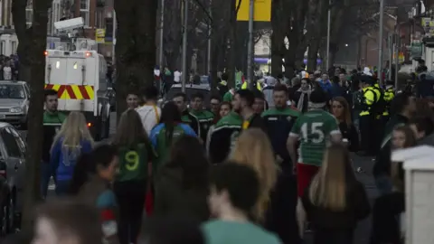 Pacemaker Young people gathered on the streets of the Holyland in Belfast during St Patrick's Day