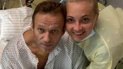Getty Images Russian opposition leader Alexei Navalny recovering in hospital in Germany in 2020 after almost being killed with by a chemical weapons attack.