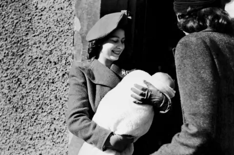 Getty Images/Mirrorpix The late Queen, then known as Princess Elizabeth, attended baby Lavinia King's baptism in Comber, County Down, in 1946