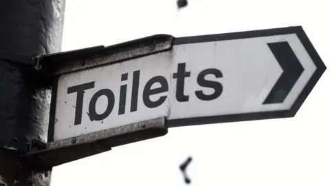 Lauren Hurley/PA Toilets sign