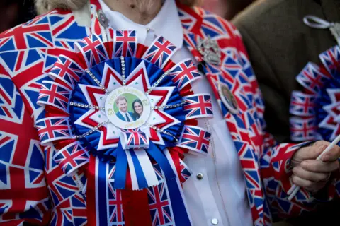 TOM NICHOLSON/EPA Royal fans line the streets ahead of the royal wedding ceremony of Britain's Prince Harry and Meghan Markle at St George's Chapel in Windsor Castle, in Windsor, Britain, 19 May 2018.