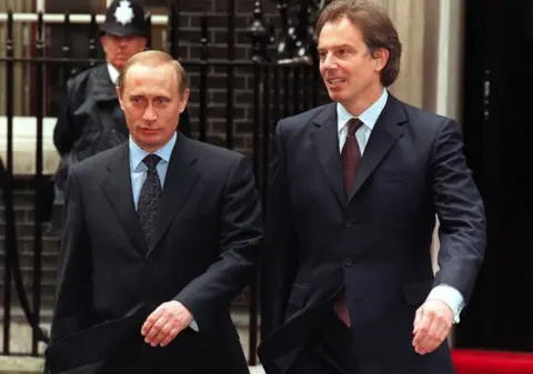 PA Media Vladimir Putin with Tony Blair during his visit to 10 Downing Street in April 2000