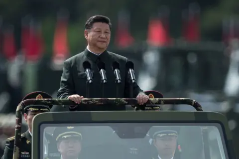 Getty Images China's President Xi Jinping inspects People's Liberation Army soldiers at a barracks in Hong Kong on 30 June 2017.