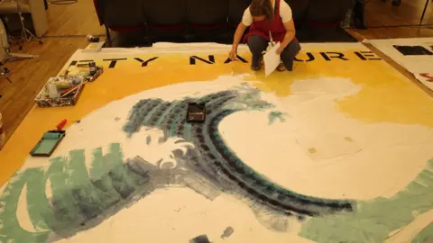 Uwe Derksen/The Margate School Claire Knights painting a wave