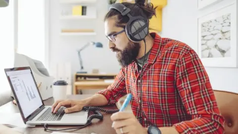 Getty Images Man working from home