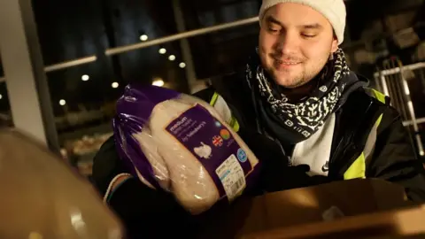 Getty Images Sainsbury worker during the Christmas period