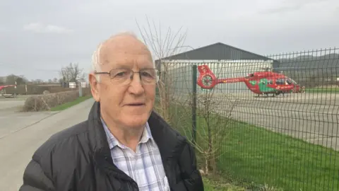 Bob Benyon in front of Welsh Ambulance Service base