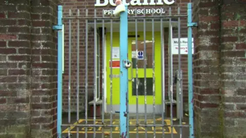 BBC Generic shot of school closed with lock on gate