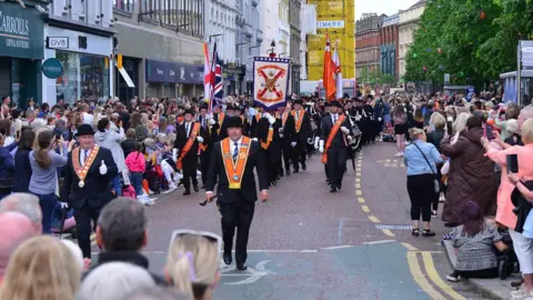 Pacemaker Orange Order members marching down Donegall Place in the city centre