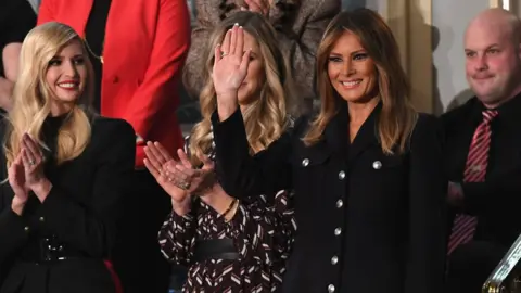 AFP US First Lady Melania Trump (R) waves, flanked by senior adviser to the president, Ivanka Trump (L)