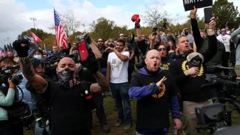 Reuters People gesture and shout slogans during a rally of the far right group Proud Boys, in Portland, Oregon, 26 September, 2020.