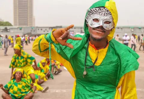 BBC man dressed in carnival costume