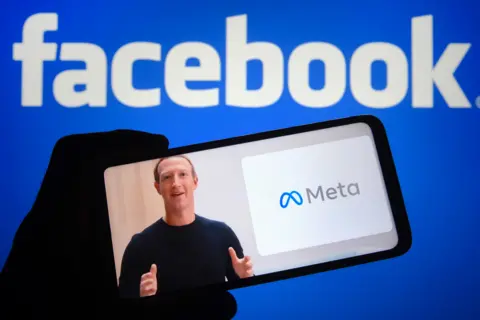 SOPA Images via Getty Images Mark Zuckerberg announcing the launch of meta on a phone