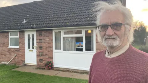 Andrew Turner/BBC Keith Gant outside his new bungalow