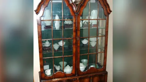 South Beds News Agency Woman's display cabinet