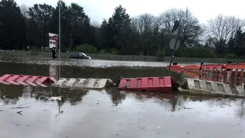 BBC A car park in Pontypridd is submerged with flood water