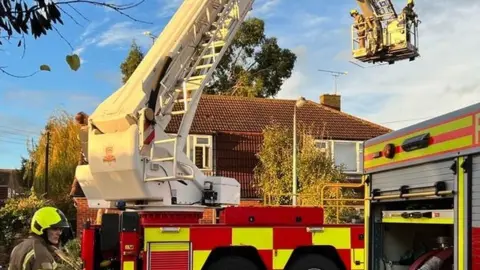 Essex County Fire and Rescue Service Firefighters at a Malden home attending a fire