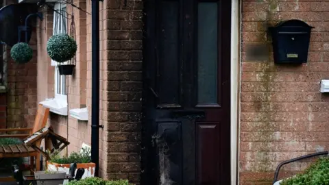 The scene of the petrol bomb attack in west Belfast