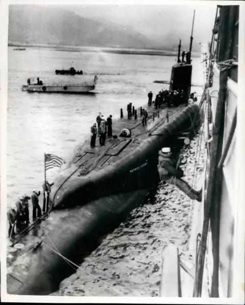 Alamy The 6700-ton American Polaris submarine ''Patrick Henry'' arrived in the Holy Loch, Firth of Clyde, today, and tied up alongside the submarine depot ship ''Porteus''