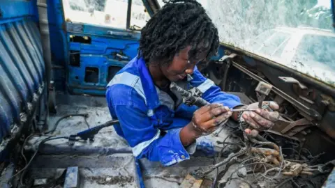 Gerald Anderson/Getty Images A female auto mechanic in Kenya's capital Nairobi - Saturday 29 April 2023