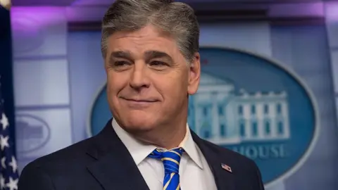 Getty Images Sean Hannity at the White House press briefing room.