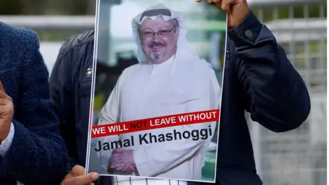 Reuters A demonstrator holds picture of Saudi journalist Jamal Khashoggi during a protest in front of Saudi Arabia's consulate in Istanbul on 5 October 2018