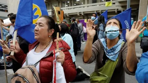 EPA Women against abortion pray in a protest against decriminalization, in front of the headquarters of the Constitutional Court, in Bogota, Colombia, 21 February 2022