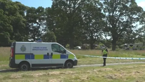 BBC Police van and tape during the search in Carlisle