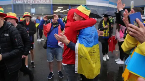 Mark Leech/Offside Wales and Ukraine fans embrace