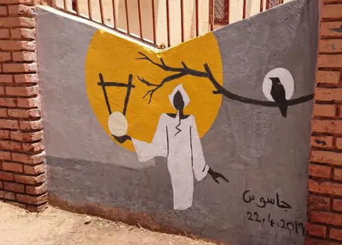 BBC A mural of a man holding a stringed instrument in Khartoum, Sudan