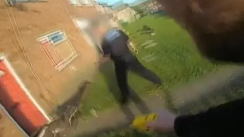 South Yorkshire Police Shot of a dog running at police officers
