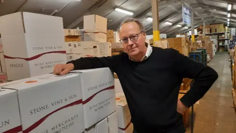 Stone, Vine & Sun Wine merchant Simon Taylor in his warehouse