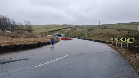 Roselees/Weather Watchers Flooded road in Denholme