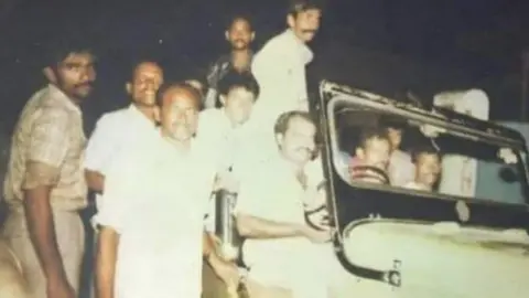 Zahid Chand baba in open jeep being driven by Atiq Ahmed
