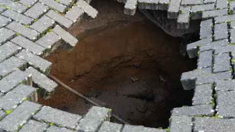 sinkhole in car park