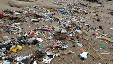 Tracey Williams Plastic rubbish washed up on a Cornish beach