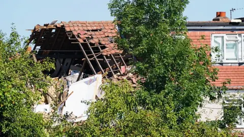 PA Media House with roof blown off