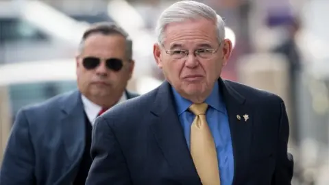 Getty Images Senator Bob Menendez arrives at federal court on 14 November in Newark, New Jersey.