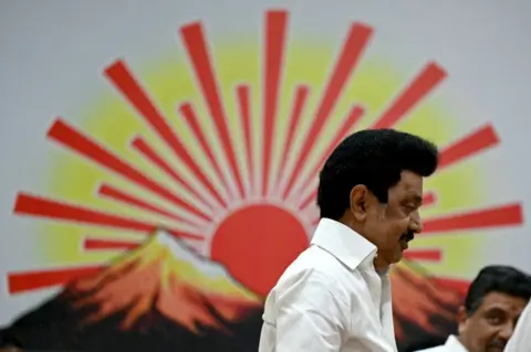 AFP Chief Minister of India's Tamil Nadu state and Dravida Munnetra Kazhagam (DMK) party president MK Stalin (L) walks past the party symbol after releasing their manifesto ahead of India's upcoming national elections in Chennai on March 20, 2024.