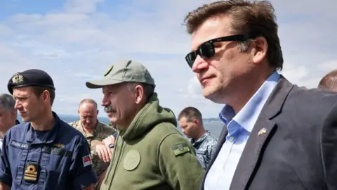 PA Media Ukraine Deputy Defence Minister Volodymyr Havrylov and Defence minister James Heappey visit a Royal Navy Sandown Class mine hunter at sea off the coat of Scotland