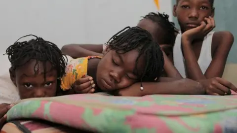 Reuters Haitian children who escaped violence in the town of Cite-Soleil are seen as they take refuge at a school