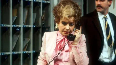 Prunella Scales and John Cleese as Sybil and Basil Fawlty in Fawlty Towers