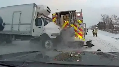 A truck crashes into a firefighter truck.