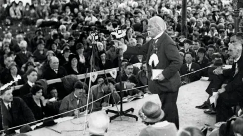 Getty Images Former UK Prime Minister David Lloyd George addresses the Urdd Eisteddfod at Machynlleth, in Powys, in 1937